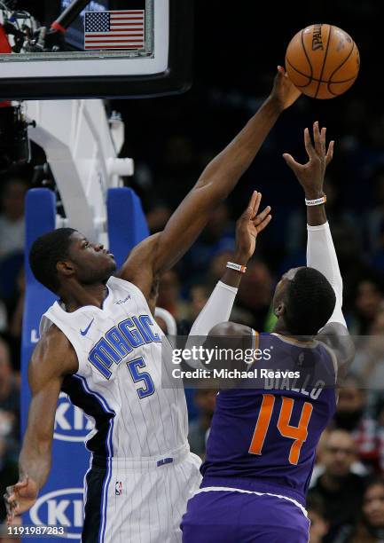 Mo Bamba of the Orlando Magic blocks a shot by Cheick Diallo of the Phoenix Suns during the first half at Amway Center on December 04, 2019 in...