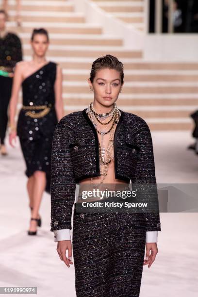 Gigi Hadid walks the runway during the Chanel Metiers d'Art 2019-2020 show at Le Grand Palais on December 04, 2019 in Paris, France.