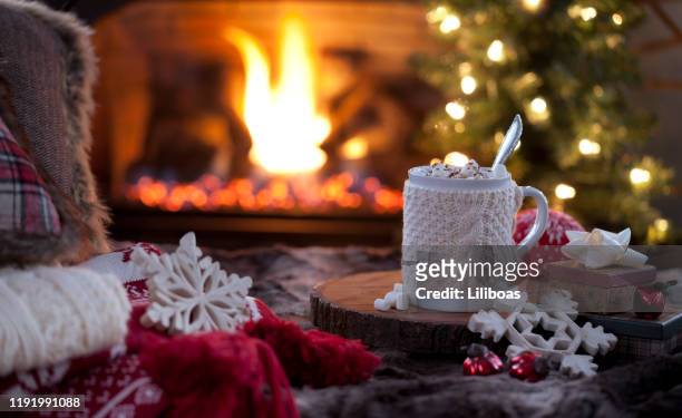 christmas cozy hot chocolate in front of the fireplace - cosy stock pictures, royalty-free photos & images