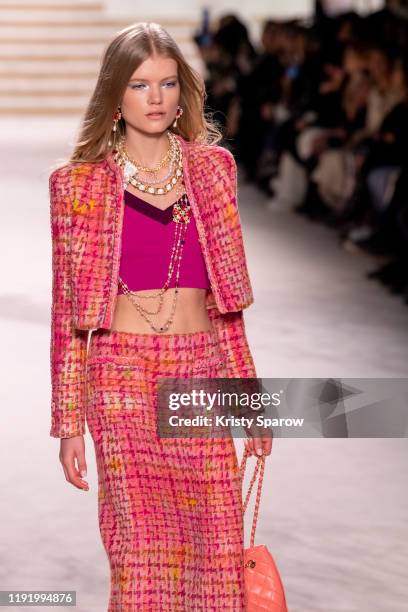 Model walks the runway during the Chanel Metiers d'Art 2019-2020 show at Le Grand Palais on December 04, 2019 in Paris, France.