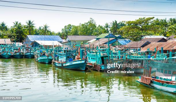 colorful fishing boats in kampot, cambodia - kampot stock pictures, royalty-free photos & images