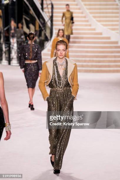 Models walk the runway during the Chanel Metiers d'Art 2019-2020 show at Le Grand Palais on December 04, 2019 in Paris, France.