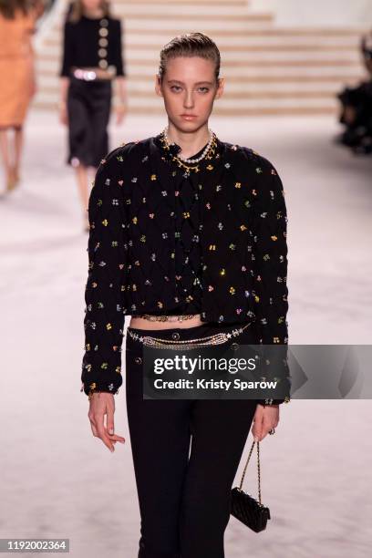 Model walks the runway during the Chanel Metiers d'Art 2019-2020 show at Le Grand Palais on December 04, 2019 in Paris, France.
