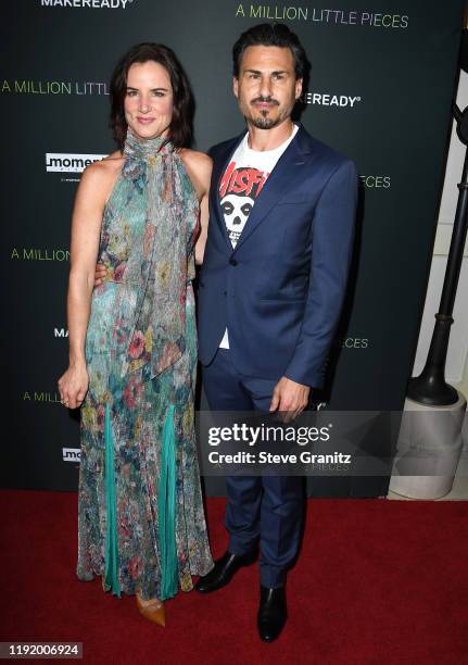 Juliette Lewis and Brad Wilk arrives at the "A Million Little Pieces" at The London Hotel on December 04, 2019 in West Hollywood, California.
