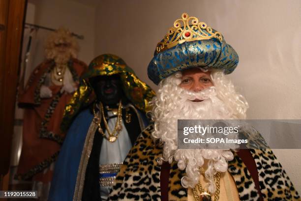 Performer dressed as Gaspar King is seen inside a house before the Cabalgata de Reyes or the Three Kings parade at the Spanish village of Rebollo de...