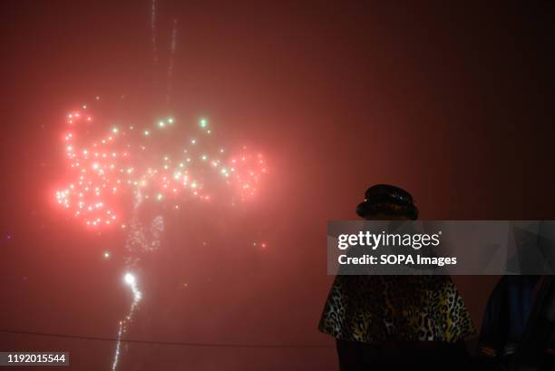 Villagers dressed as Gaspar King watch fireworks during the Cabalgata de Reyes or the Three Kings parade at the Spanish village of Rebollo de Duero....