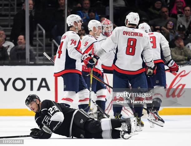 Dustin Brown of the Los Angeles Kings reacts as the Washington Capitals celebrate an empty net goal during the third period in a 3-1 Capitals win at...