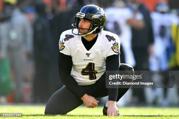 Punter Sam Koch of the Baltimore Ravens waits for the snap on an extra point attempt in the second quarter of a game against the Cleveland Browns on...