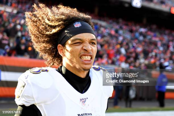Wide receiver Willie Snead of the Baltimore Ravens poses for a picture as he runs onto the field at halftime of a game against the Cleveland Browns...