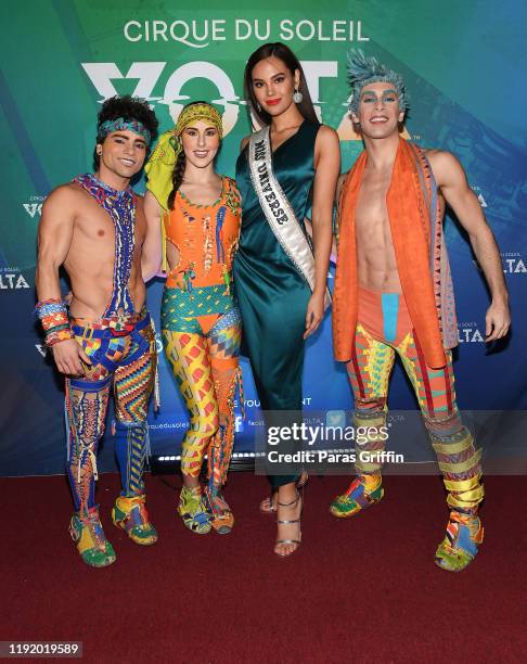 Miss Universe Catriona Gray poses with cast members of Volta during Volta By Cirque Du Soleil at Atlantic Station on December 04, 2019 in Atlanta,...