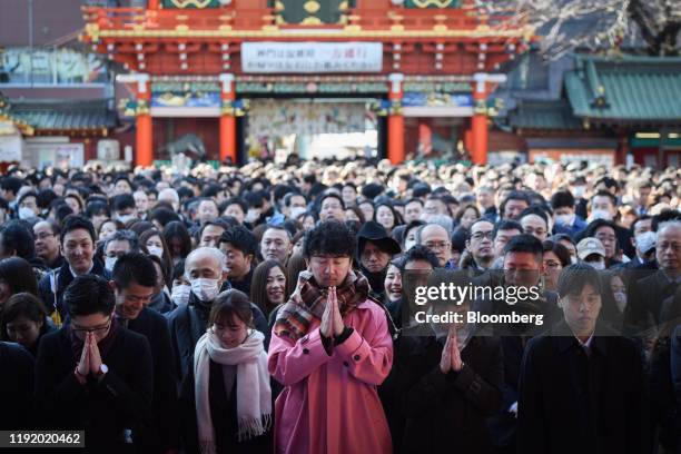 People offer prayers on the first business day of the year at the Kanda Myojin shrine in Tokyo, Japan, on Monday, Jan. 6, 2020. Japanese stocks fell...