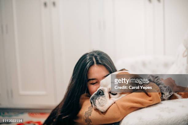 female taking care of her dog - pets foto e immagini stock