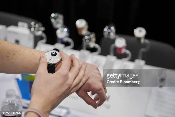 Person uses the ScanWatch heart monitoring watch, developed by Withings, during CES Unveiled at the CES 2020 event in Las Vegas, Nevada, U.S., on...