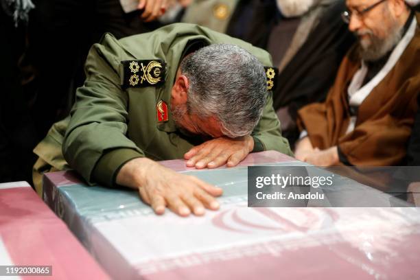 Soleimanis long-time lieutenant and the new leader of Quds Force Gen. Esmail Qaani cries over the coffin during the funeral ceremony of Qasem...