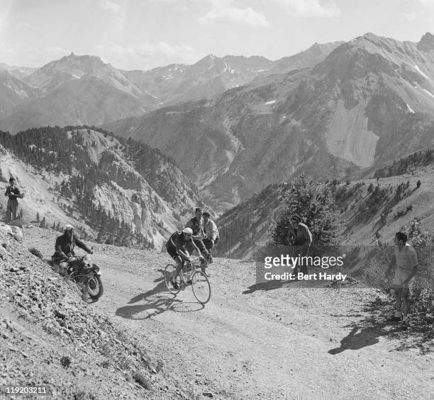 Italian rider Fausto Coppi near the snow line in the French Alps during the Tour de France, July 1951. Coppi finished the tour in 10th place overall....