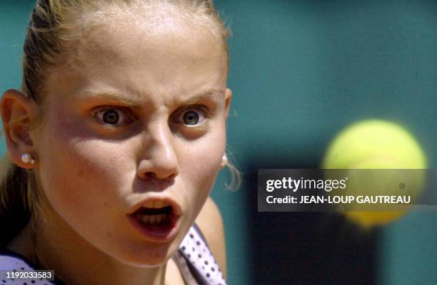 Yugoslavia's Jelena Dokic eyes the ball during her Roland-Garros French Open third round match against Elena Likhovtseva of Russia, 01 June 2002 in...