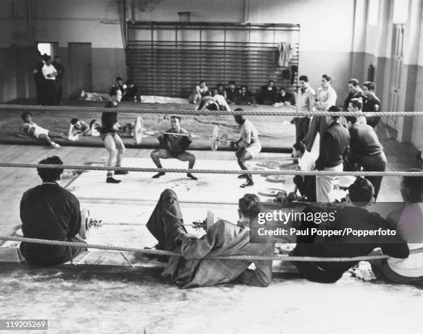Athletes training with weights at a Richmond gymnasium for the 1948 Summer Olympics in London.