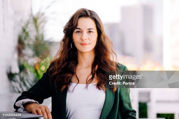 confident businesswoman at hotel - brown hair stock pictures, royalty-free photos & images