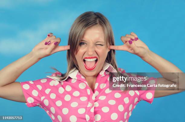 woman covering ears - hands covering ears stock pictures, royalty-free photos & images