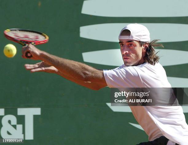 Tennis player Fernando Meligeni is seen in action in Buenos Aires, Argentina 20 February 2003. El brasileño Fernando Meligeni le devuelve de revés la...