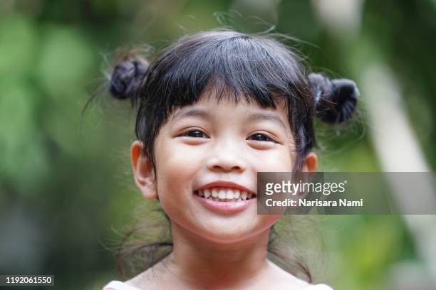 happy cute smiling asian kid. face expression concept. - very young thai girls stock pictures, royalty-free photos & images