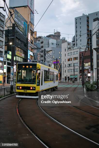 tramway that draws a curve and climbs a hill - toshima, tokyo - tokyo toden stock pictures, royalty-free photos & images