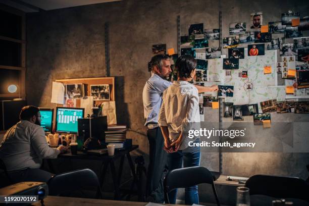 three detectives working together in office - detective badge stock pictures, royalty-free photos & images