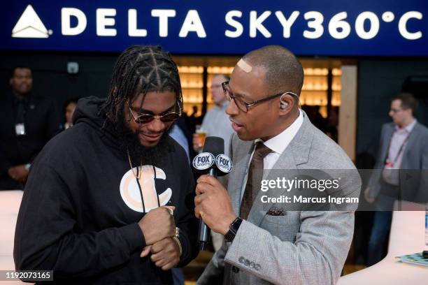 Rapper Big K.R.I.T. Interviews with media during the New Jersey Nets vs Atlanta Hawks halftime show at State Farm Arena on December 04, 2019 in...