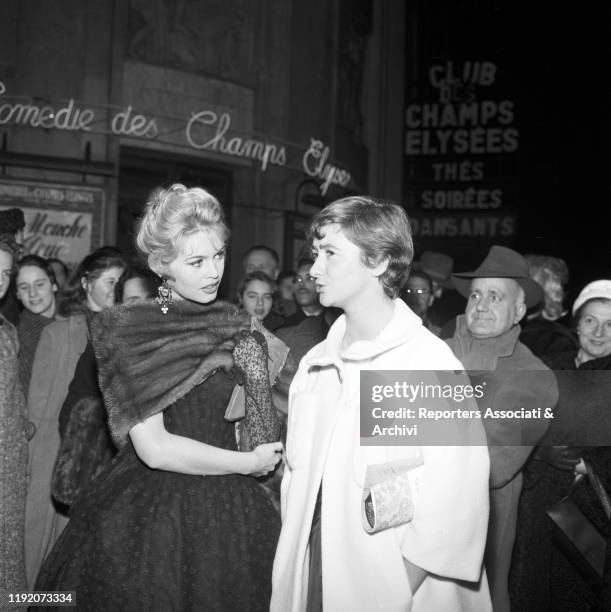 French actress Brigitte Bardot talking to French writer Francoise Sagan . France, 21st January 1958