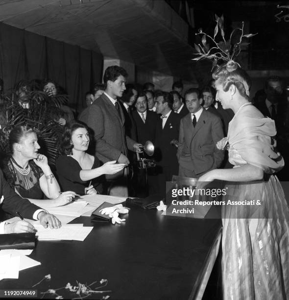 Italian stylist Micol Fontana attending to a fashion event in Eur. Rome, 1955
