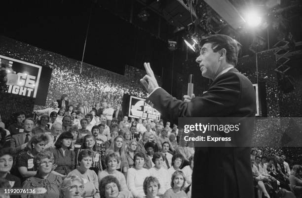 English comedian, actor, TV presenter, and game show host Leslie Crowther hosting television game show "The Price Is Right", UK, 15th December 1984.