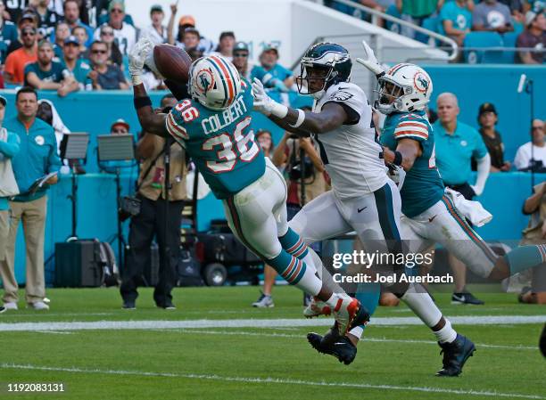 Adrian Colbert of the Miami Dolphins is unable to catch the ball while being defended by Alshon Jeffery of the Philadelphia Eagles during an NFL game...