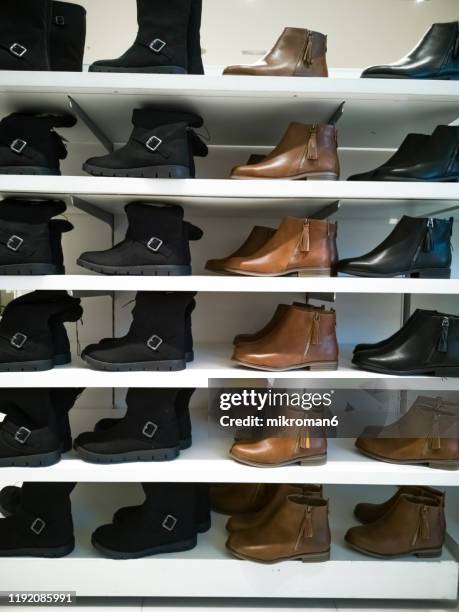 women's footwear in shopping mall - boot sale stock pictures, royalty-free photos & images