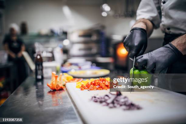 chef cutting vegetables in kitchen - dice stock pictures, royalty-free photos & images