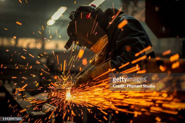 metal worker using a grinder - making stock pictures, royalty-free photos & images