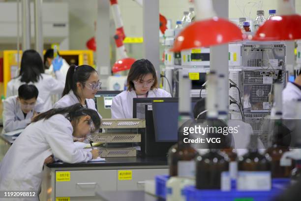 Employees work at the center for early phase pharmaceutical development of Asymchem Laboratories Inc, a medical company, on December 4, 2019 in...