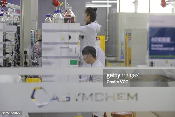 Employees work at the center for early phase pharmaceutical development of Asymchem Laboratories Inc, a medical company, on December 4, 2019 in...