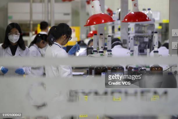 Employees work at the center for early phase pharmaceutical development of Asymchem Laboratories Inc, a medical company, on December 4, 2019 in...