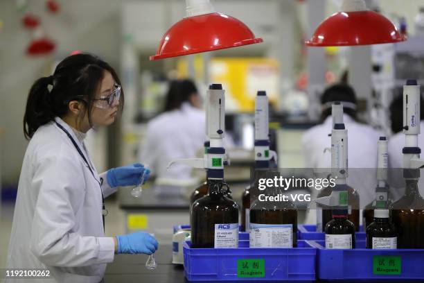 Employees work at the center for early phase pharmaceutical development of Asymchem Laboratories Inc, a medical company, on December 4, 2019 in...