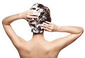 Woman soaping the hair. Beauty treatment