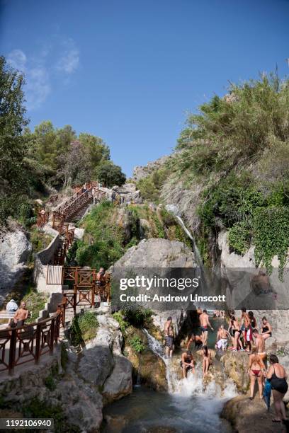 people swimming and having fun at les fonts de l'agar - altea spain stock pictures, royalty-free photos & images