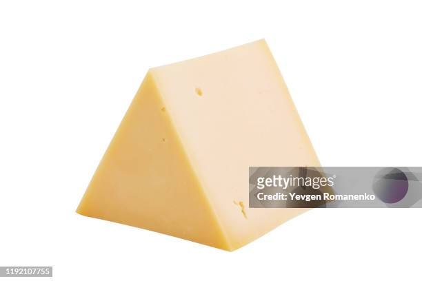 triangle cheese chunk isolated on white background - cheddar cheese stockfoto's en -beelden