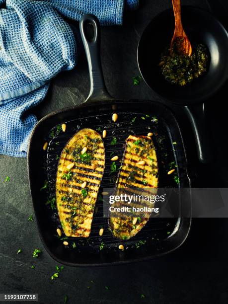 grilled aubergine steak with green pesto sauce - eggplant imagens e fotografias de stock