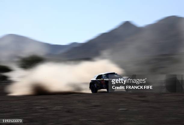 Peugeot's driver Khalid Sheikh Al Qassimi of Saudi Arabia and co-driver French Xavier Panseri compete during the Stage 2 of the Dakar 2020 between Al...