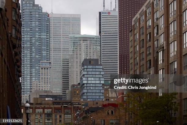 office and residential buildings in a dense urban cityscape - bay street photos et images de collection