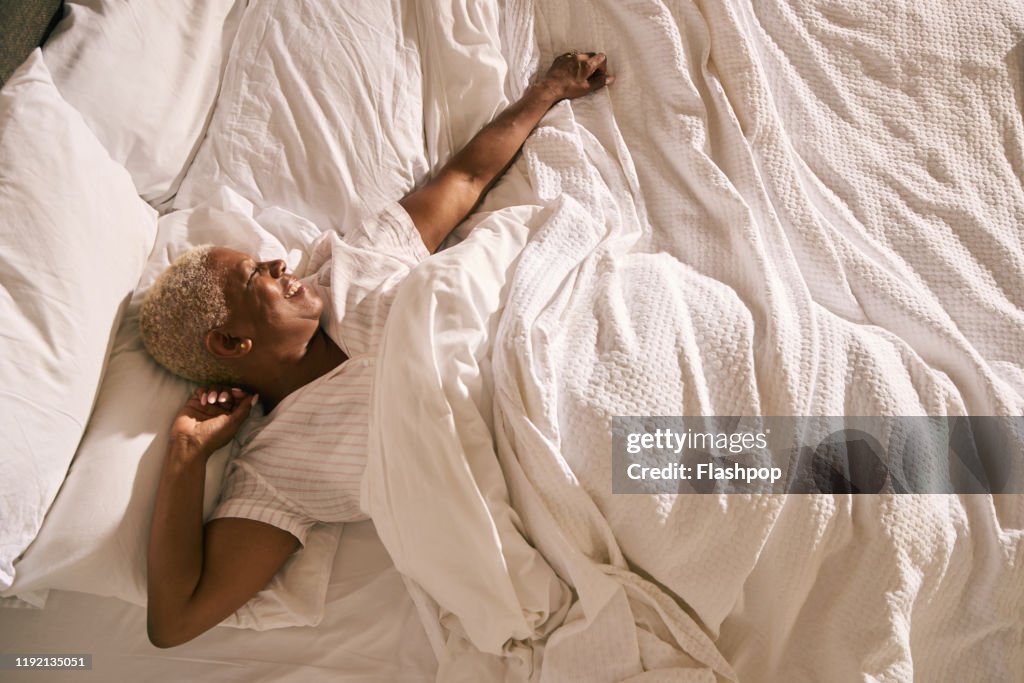 Mature woman in bed (morning)