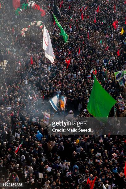 Mourners burn U.S. And Israeli flags during a funeral ceremony of Iranian Major General Qassem Soleimani and others who were killed in Iraq by a U.S....