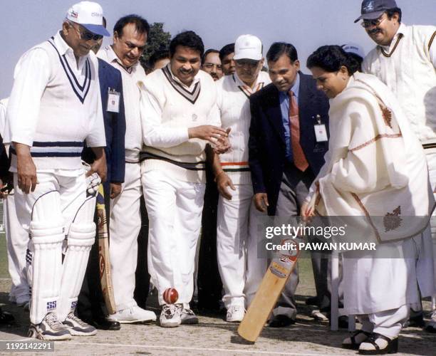 Uttar Pradesh state Chief Minister Mayawati plays a ball on the opening of an exhibition cricket match between the Parliament XI and Chief Minister's...