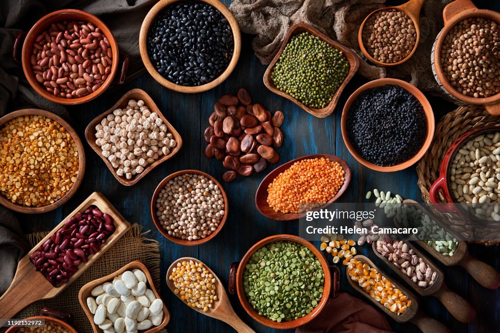 Legumes and beans on a rustic wooden table