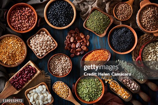 Legumes and beans on a rustic wooden table Legumes and beans on a rustic wooden table